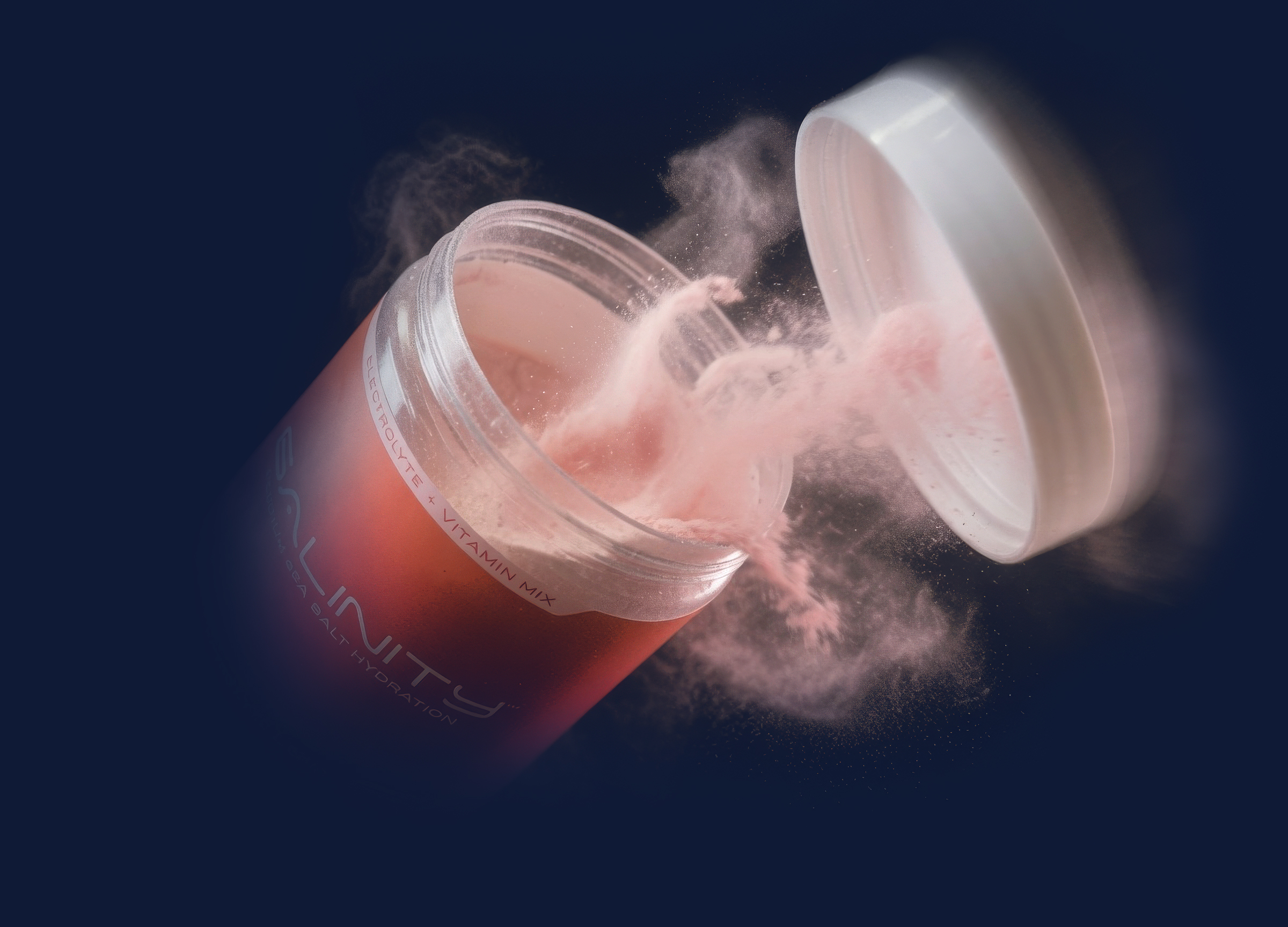 Salinity Watermelon tub tipped open with a burst of pink electrolyte powder